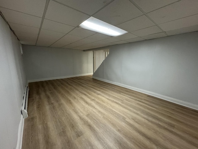 8852 Robin Dr Unit E, Des Plaines, IL 60016 - finished below grade area featuring a paneled ceiling, wood finished floors, and baseboard heating