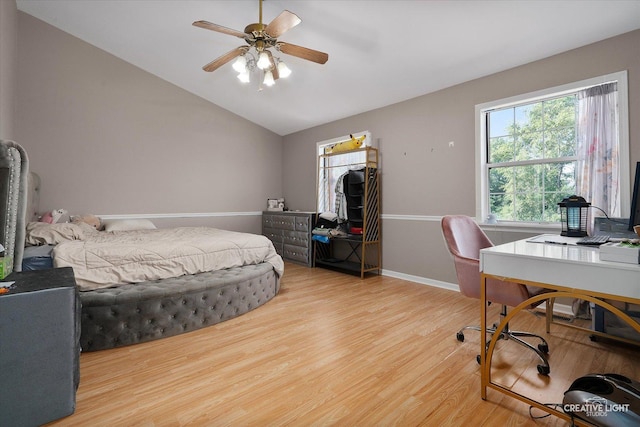 61 King Dr, Streamwood, IL 60107 - bedroom featuring light wood-style floors, a desk, vaulted ceiling, and a ceiling fan