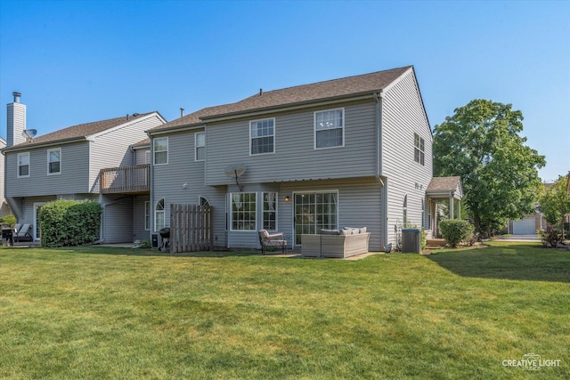 61 King Dr, Streamwood, IL 60107 - rear view of property with an outdoor hangout area and a lawn