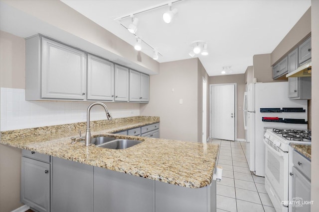 61 King Dr, Streamwood, IL 60107 - kitchen featuring white range with gas stovetop, a peninsula, under cabinet range hood, gray cabinets, and light stone countertops