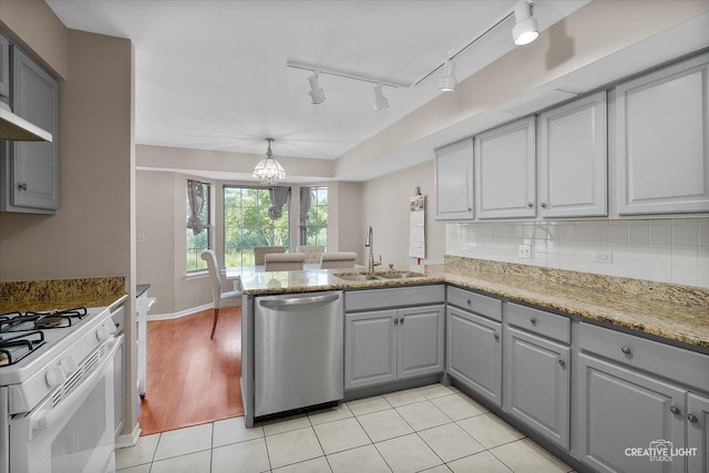 61 King Dr, Streamwood, IL 60107 - kitchen with stainless steel dishwasher, gray cabinets, track lighting, white gas range, and a chandelier