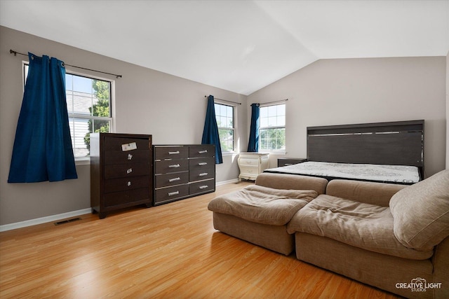 61 King Dr, Streamwood, IL 60107 - bedroom with multiple windows, wood finished floors, and lofted ceiling