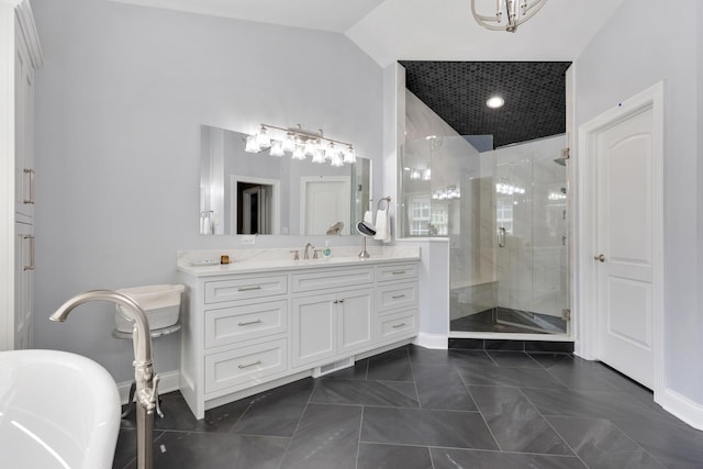 700 E Sunnyside Ave, Libertyville, IL 60048 - bathroom featuring a stall shower, a freestanding tub, vanity, a chandelier, and vaulted ceiling