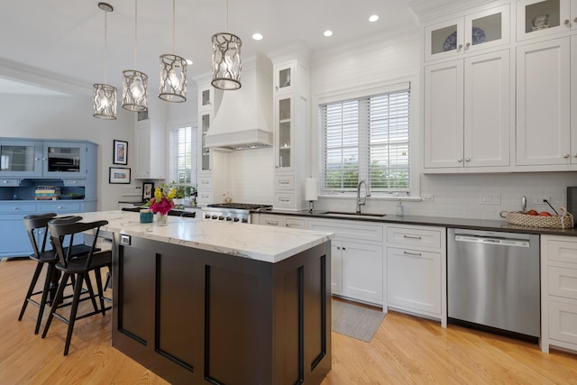 700 E Sunnyside Ave, Libertyville, IL 60048 - kitchen with dishwasher, a kitchen island, decorative backsplash, plenty of natural light, and crown molding