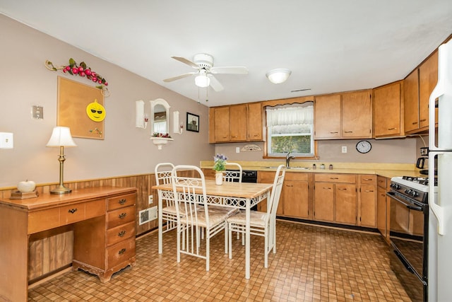 456 W Stanton Ln, Crete, IL 60417 - kitchen featuring gas stove, a ceiling fan, light countertops, wainscoting, and light floors