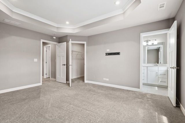 10606 Paige Ct, Orland Park, IL 60462 - unfurnished bedroom featuring a tray ceiling, light colored carpet, recessed lighting, a spacious closet, and connected bathroom