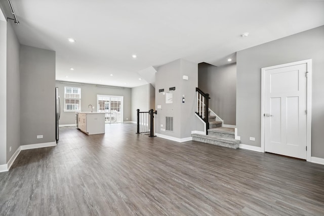 10606 Paige Ct, Orland Park, IL 60462 - unfurnished living room with dark wood finished floors, stairway, and recessed lighting