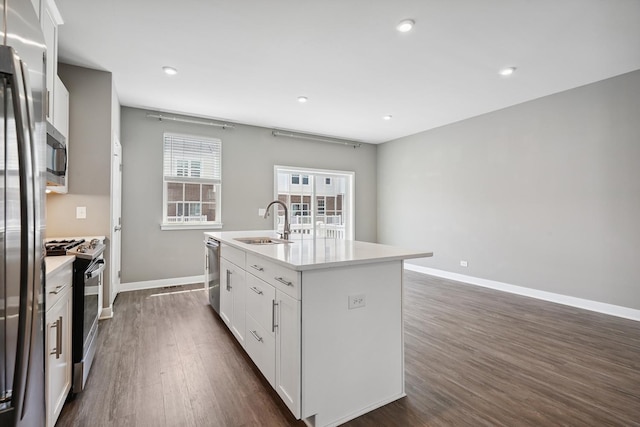 10606 Paige Ct, Orland Park, IL 60462 - kitchen featuring stainless steel appliances, a center island with sink, dark wood-type flooring, white cabinetry, and recessed lighting