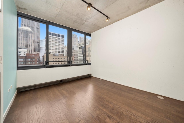 235 W Van Buren St Unit 1720, Chicago, IL 60607 - empty room with a view of skyline, wood finished floors, and track lighting