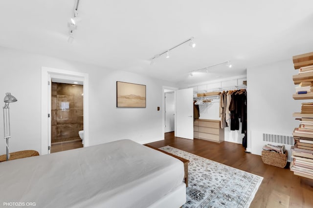 300 Thames Pkwy Unit 2A, Park Ridge, IL 60068 - bedroom featuring track lighting, wood finished floors, ensuite bath, and a spacious closet