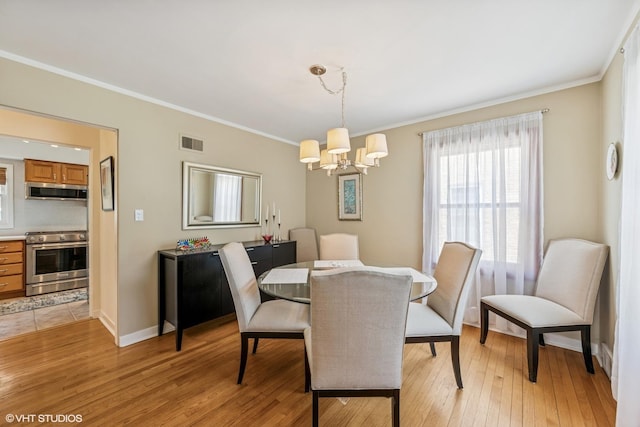 530 S Vail Ave, Arlington Heights, IL 60005 - dining space with a chandelier, crown molding, and light wood-type flooring