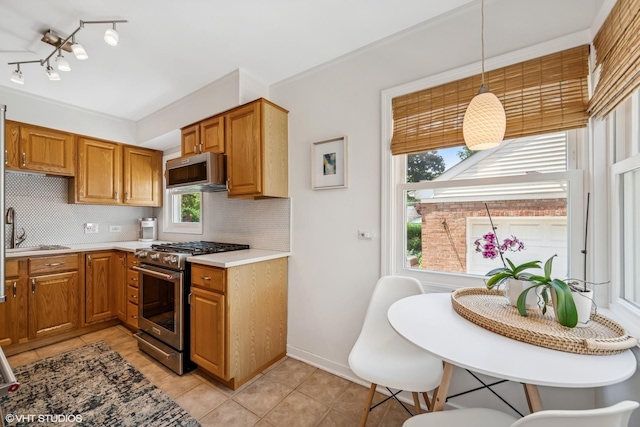 530 S Vail Ave, Arlington Heights, IL 60005 - kitchen featuring stainless steel appliances, tasteful backsplash, light tile patterned floors, and light countertops