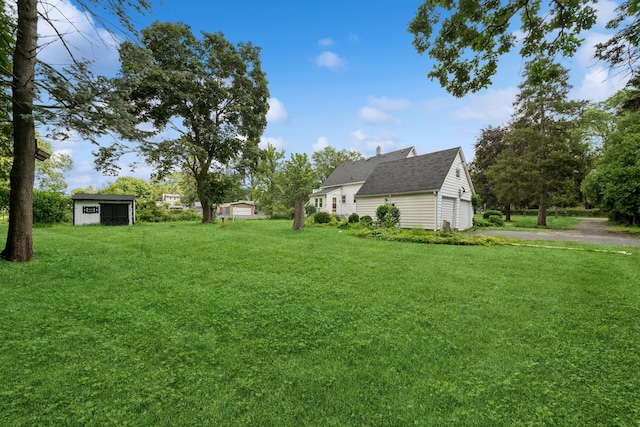 456 Grove St, Wood Dale, IL 60191 - view of grassy yard featuring an outbuilding