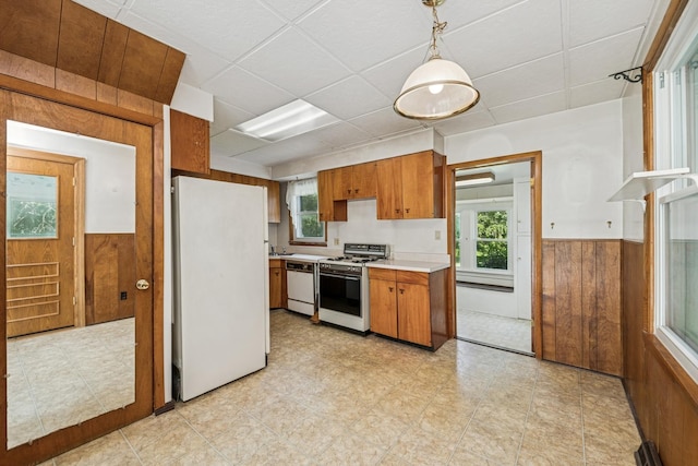 456 Grove St, Wood Dale, IL 60191 - kitchen with white appliances, wood walls, light countertops, wainscoting, and brown cabinetry