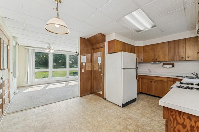 456 Grove St, Wood Dale, IL 60191 - kitchen with freestanding refrigerator, brown cabinetry, light countertops, a paneled ceiling, and range