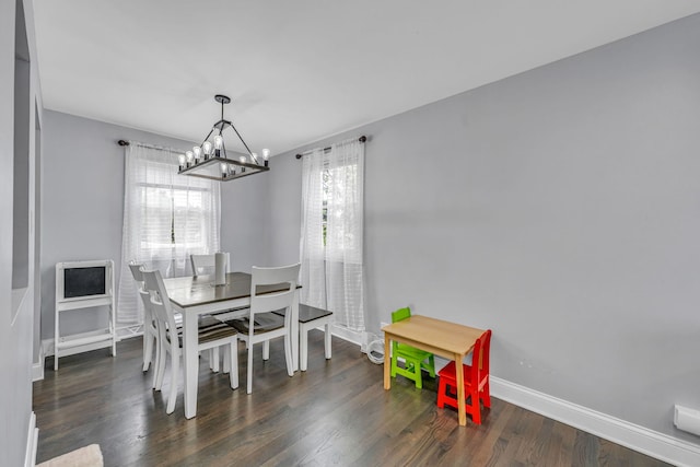 9113 Sycamore Dr, Hickory Hills, IL 60457 - dining room featuring a chandelier and wood finished floors