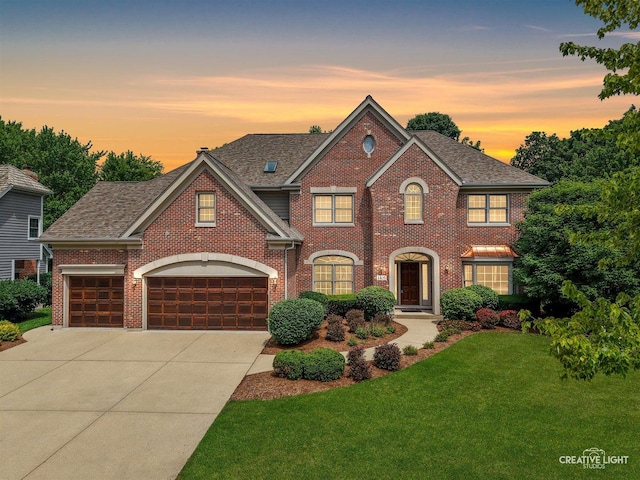 1105 Thoroughbred Cir, Saint Charles, IL 60174 - view of front of house featuring driveway, brick siding, a lawn, roof with shingles, and a garage