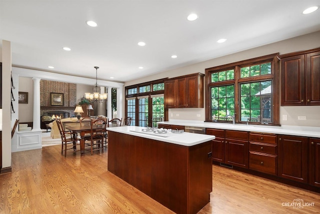1105 Thoroughbred Cir, Saint Charles, IL 60174 - kitchen with light countertops, white gas cooktop, a kitchen island, light wood-style floors, and recessed lighting