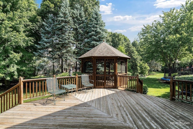 1105 Thoroughbred Cir, Saint Charles, IL 60174 - wooden terrace featuring a trampoline, a gazebo, a lawn, and view of scattered trees