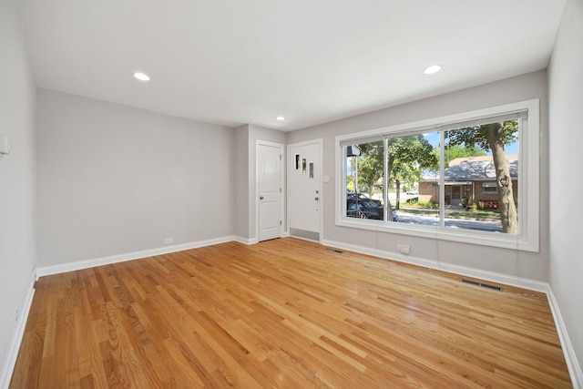 6037 N Nagle Ave, Chicago, IL 60646 - unfurnished room featuring light wood-style floors and recessed lighting