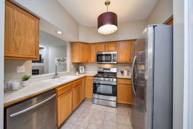 838 Stuarts Dr, Saint Charles, IL 60174 - kitchen featuring appliances with stainless steel finishes, light countertops, light tile patterned floors, hanging light fixtures, and brown cabinets