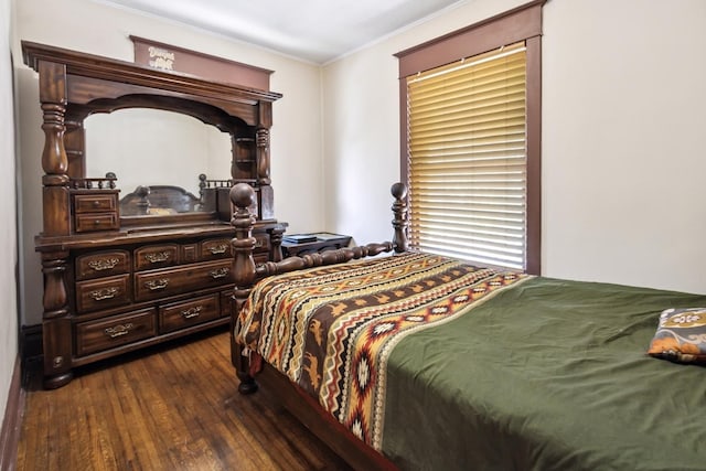 809 W 4th St, Sterling, IL 61081 - bedroom with dark wood-type flooring and ornamental molding