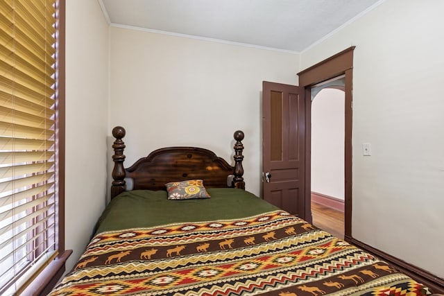 809 W 4th St, Sterling, IL 61081 - bedroom featuring ornamental molding and wood finished floors