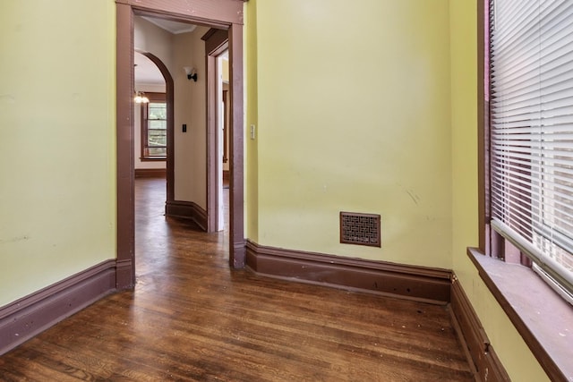 809 W 4th St, Sterling, IL 61081 - hall featuring arched walkways, wood finished floors, and ornamental molding