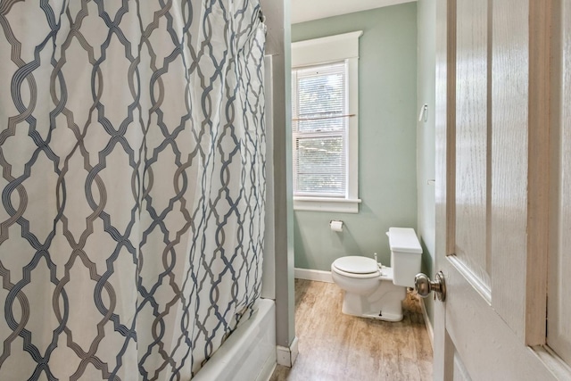 809 W 4th St, Sterling, IL 61081 - bathroom with wood finished floors and shower / tub combo