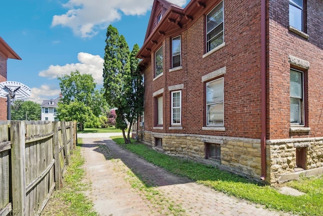 809 W 4th St, Sterling, IL 61081 - view of property exterior featuring brick siding