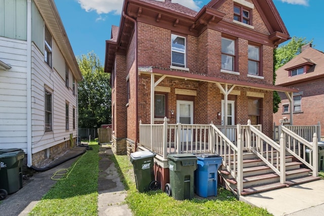 809 W 4th St, Sterling, IL 61081 - multi unit property with brick siding and a porch