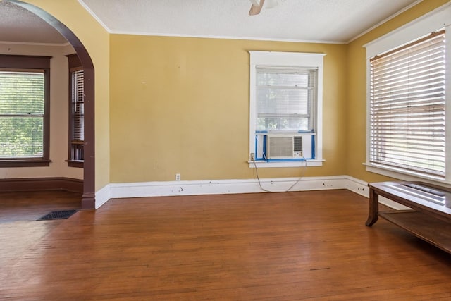 809 W 4th St, Sterling, IL 61081 - spare room with wood finished floors, ornamental molding, arched walkways, and a ceiling fan