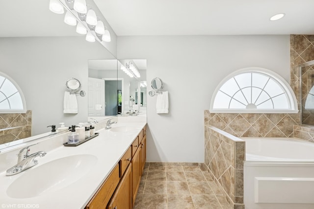 1460 Canter Ln, Bartlett, IL 60103 - full bathroom with healthy amount of natural light, a garden tub, double vanity, and a tile shower