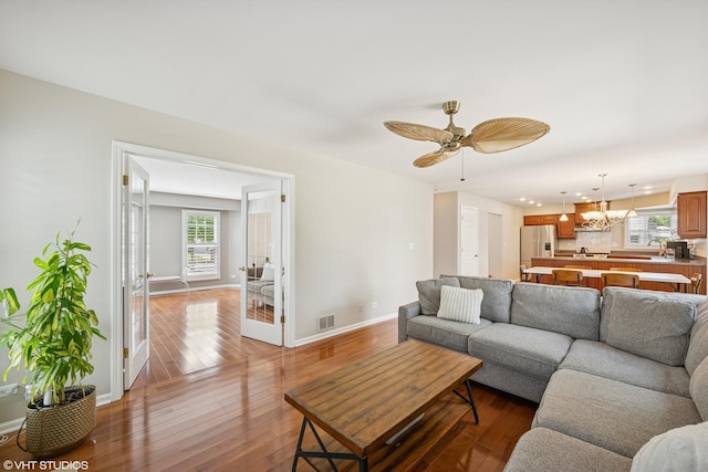 1460 Canter Ln, Bartlett, IL 60103 - living room featuring wood-type flooring, a ceiling fan, and a chandelier