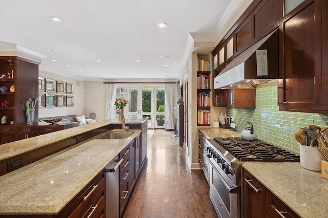 2446 N Janssen Ave, Chicago, IL 60614 - kitchen featuring high end stove, recessed lighting, light stone countertops, dark wood-style floors, and ornamental molding