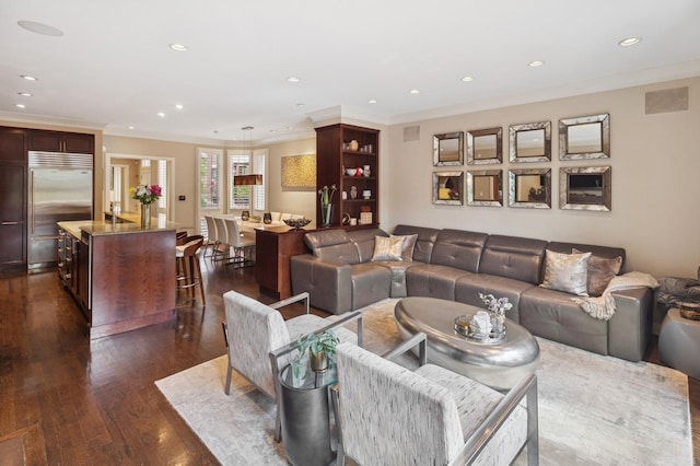 2446 N Janssen Ave, Chicago, IL 60614 - living room featuring dark wood-style flooring, crown molding, and recessed lighting