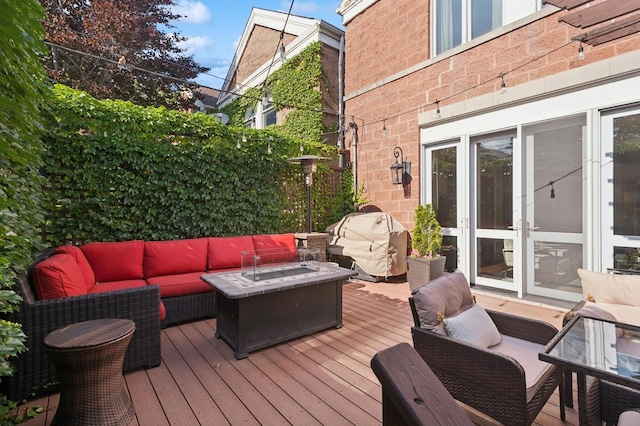 2446 N Janssen Ave, Chicago, IL 60614 - wooden deck featuring an outdoor living space with a fire pit
