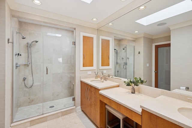 2446 N Janssen Ave, Chicago, IL 60614 - full bathroom featuring a skylight, double vanity, a stall shower, and recessed lighting