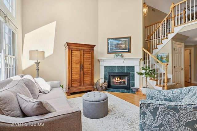 3716 King Charles Ln, Saint Charles, IL 60174 - living area with a towering ceiling, a fireplace, stairs, and wood finished floors