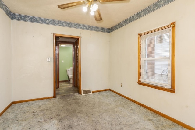 607 W Grant Ave, Pontiac, IL 61764 - carpeted empty room featuring ceiling fan and baseboards