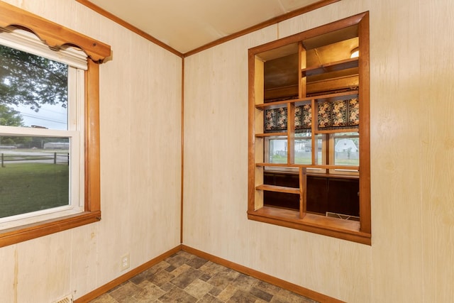 607 W Grant Ave, Pontiac, IL 61764 - empty room featuring crown molding and stone finish flooring