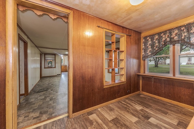 607 W Grant Ave, Pontiac, IL 61764 - spare room with wood walls and wood finished floors
