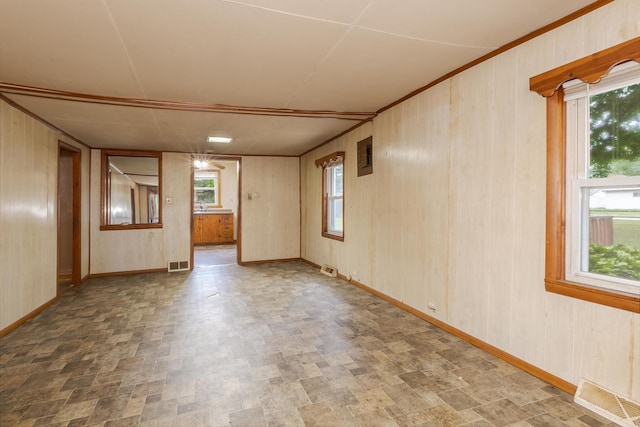 607 W Grant Ave, Pontiac, IL 61764 - unfurnished room featuring electric panel and wood walls