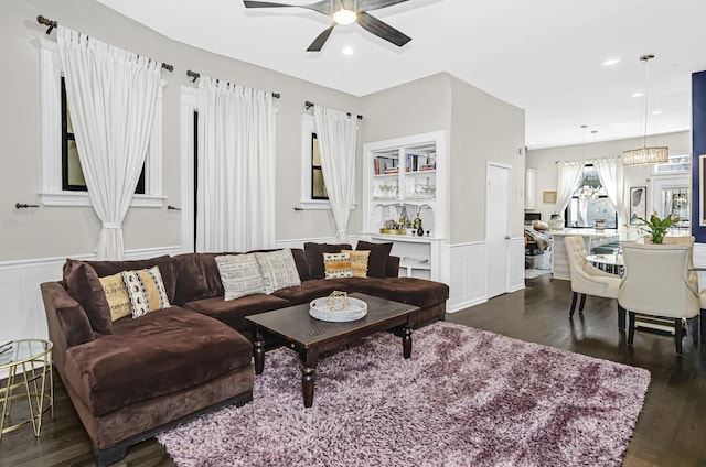 4738 S Champlain Ave, Chicago, IL 60615 - living area featuring dark wood-style flooring, ceiling fan, a wainscoted wall, a decorative wall, and recessed lighting