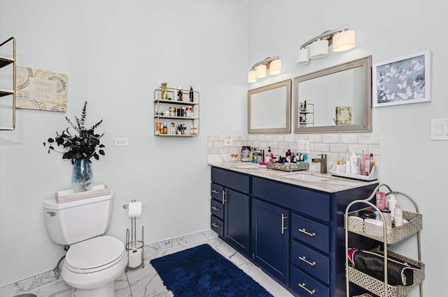 4738 S Champlain Ave, Chicago, IL 60615 - bathroom featuring marble finish flooring, double vanity, and backsplash