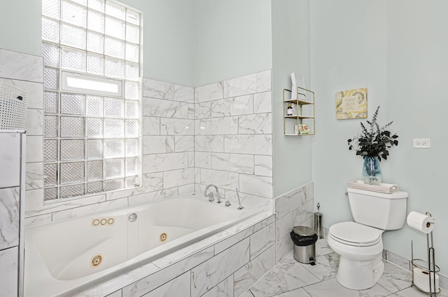 4738 S Champlain Ave, Chicago, IL 60615 - bathroom with a tub with jets and marble look tiles