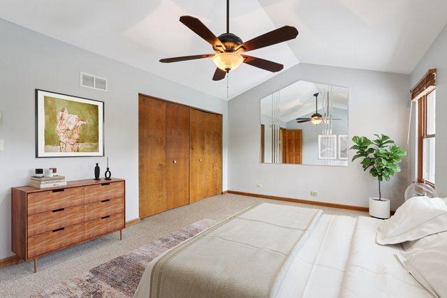 584 Beaconsfield Ave, Naperville, IL 60565 - bedroom with lofted ceiling, a ceiling fan, and a closet
