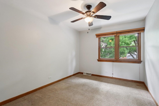 584 Beaconsfield Ave, Naperville, IL 60565 - spare room featuring carpet floors and a ceiling fan