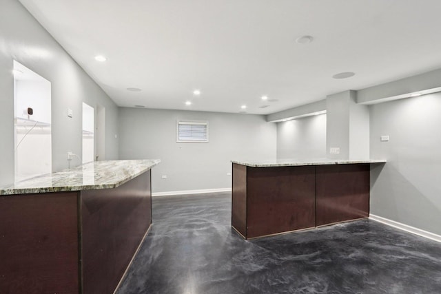 584 Beaconsfield Ave, Naperville, IL 60565 - kitchen with concrete floors, light stone countertops, a peninsula, and recessed lighting