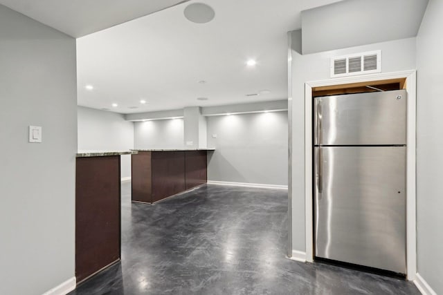 584 Beaconsfield Ave, Naperville, IL 60565 - kitchen with freestanding refrigerator, finished concrete floors, recessed lighting, a peninsula, and light stone counters